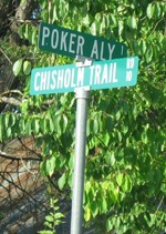 Street sign: Poker Aly and Chisholm Trail